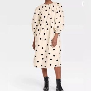 One Girl Who Cream and Black Polka Dot Dress